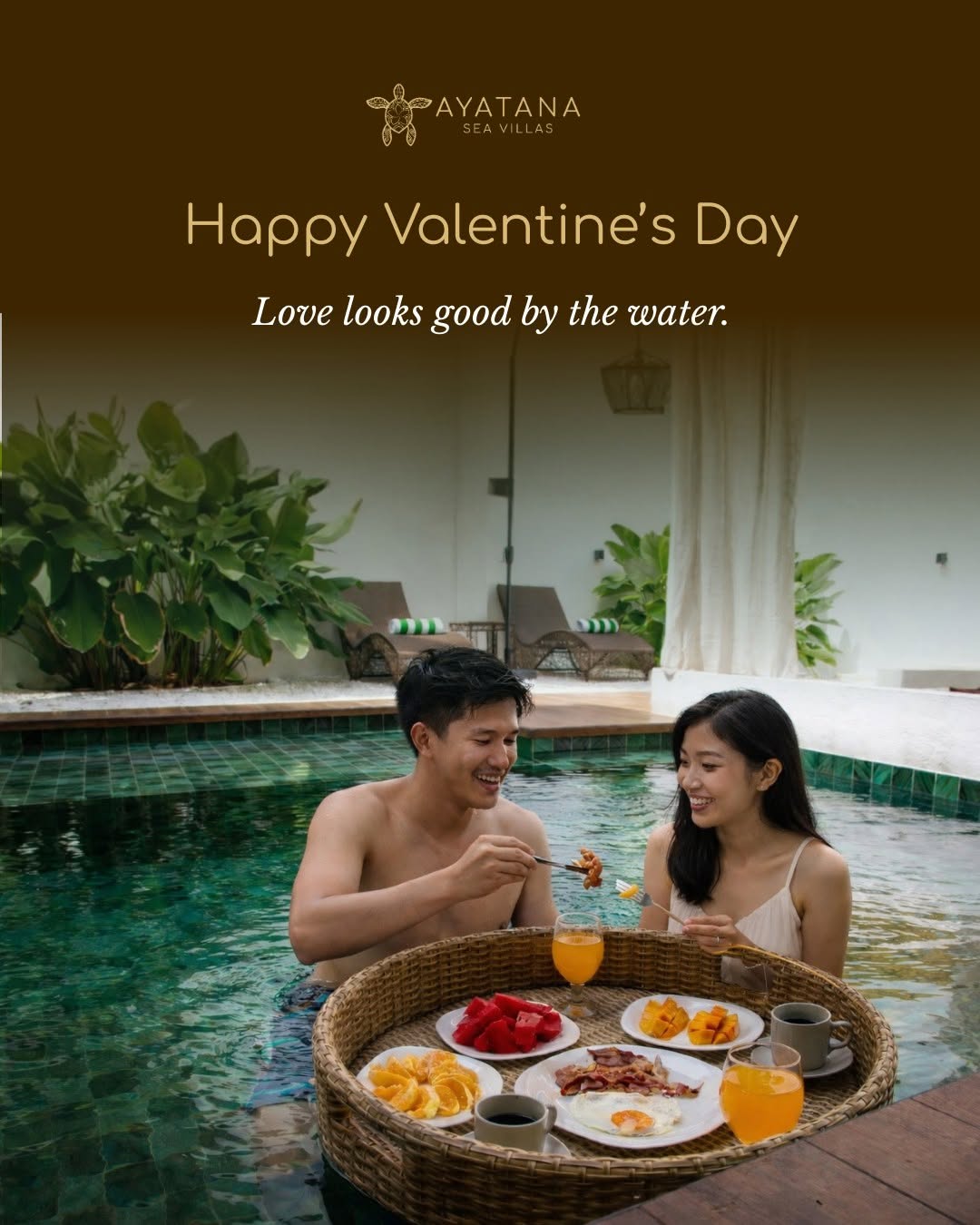Couple enjoying a floating breakfast tray with fruit, coffee, and juice in the private pool